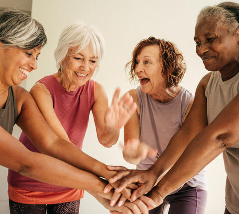 A photo of elderly women exercising together