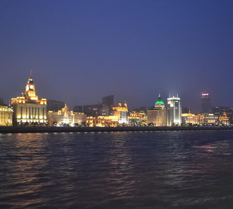 Shanghai's waterfront skyline lit up at night.