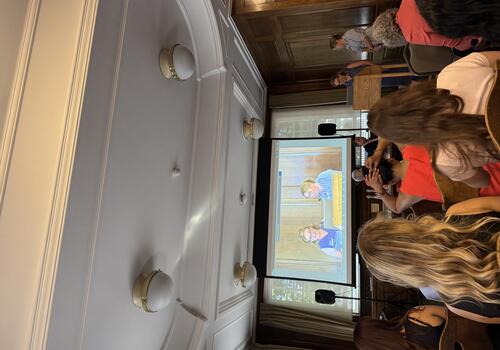 Watching a presentation at a conference