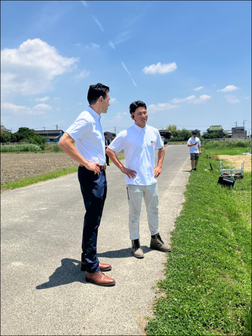 two people talking outside