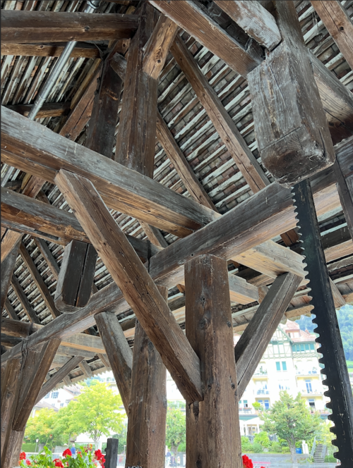 Exposed timber framing on a historic covered bridge in Interlaken