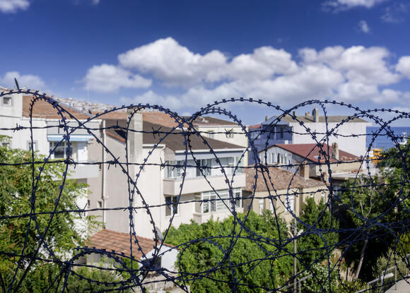 Barbed wire from correctional center and surrounding community 