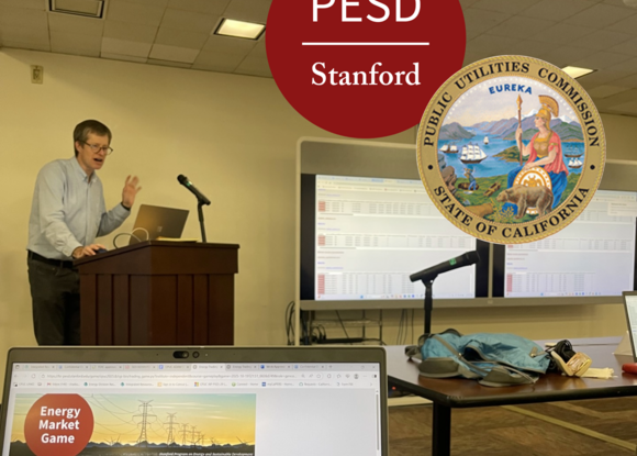 Mark Thurber teaching with Energy Market Game computer screen in foreground