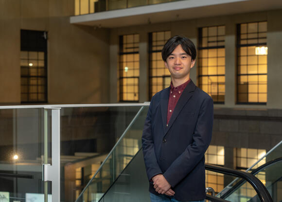 a person in a suit standing