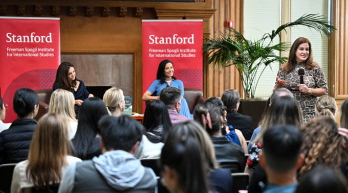 Sheryl Sandberg [left] and Dina Powell McCormick [right] onstage in front of an audience at the Freeman Spogi Institute for International Studies.