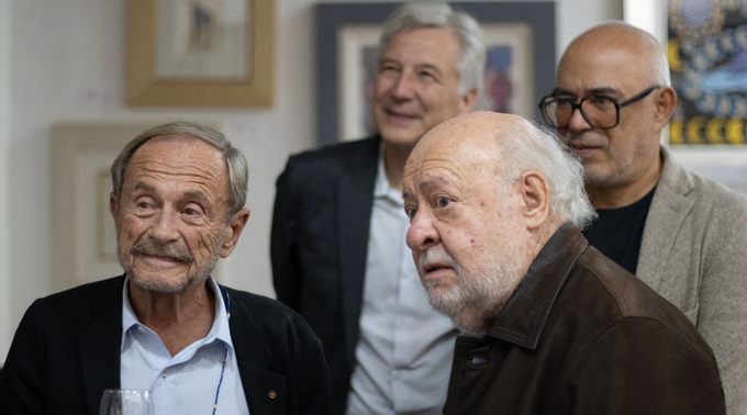 Prof. Adam Przeworski talking to reception attendees, including Miguel Ángel Porrúa (front right), founder of the publishing house. 