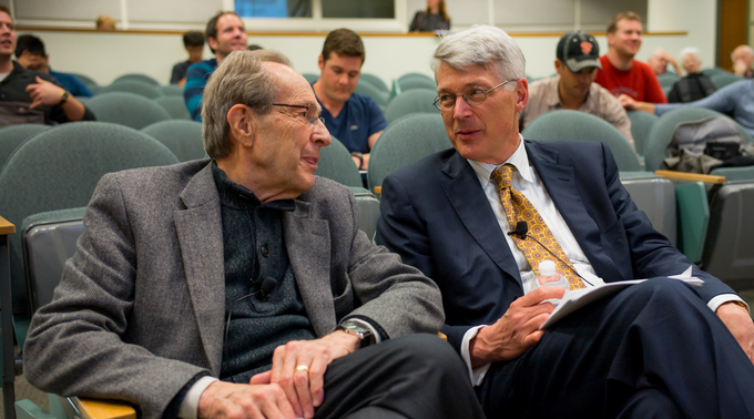 Scott Sagan (right) sits next to former Secretary of Defense William Perry (left)