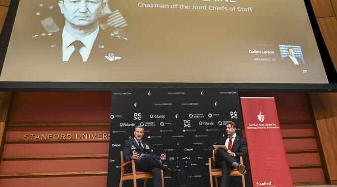 General Dan Caine, chairman of the joint chiefs of staff, is interviewed on stage by Collen Larson, MBA/MSCS '27