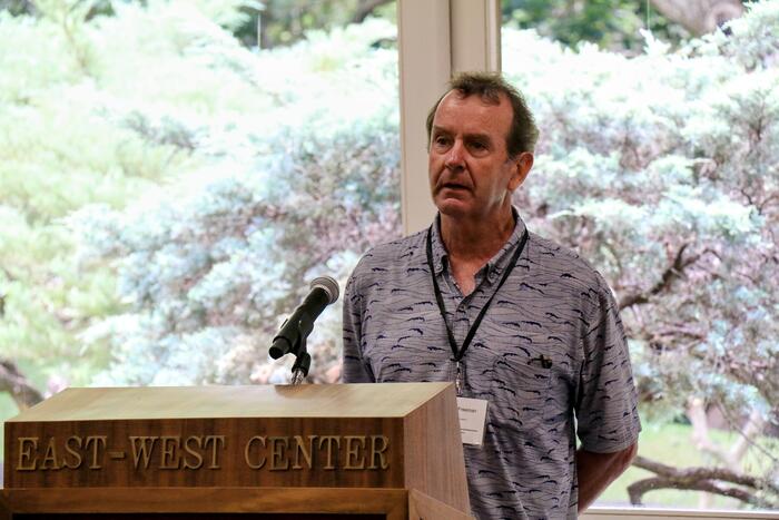 a person speaking at the podium