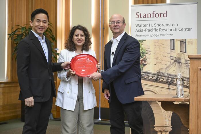 Kiyoteru Tsutsui and James Hamilton present the 2026 Shorenstein Journalism Award to Shibani Mahtani.