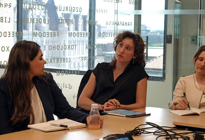 Rachel Owens asks a question during the Honor College site visit at the National Endowment for Democracy.
