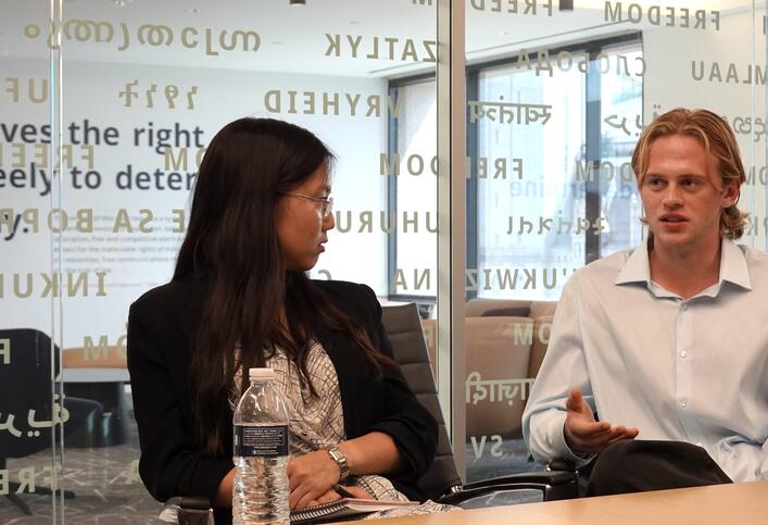 Garry Piepenbrock asks a question during the Honors College site visit to the National Endowment for Democracy.