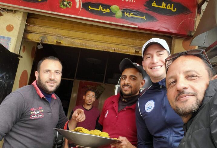 Luis Sanchez with local guides at a resturaunt in Egypt.