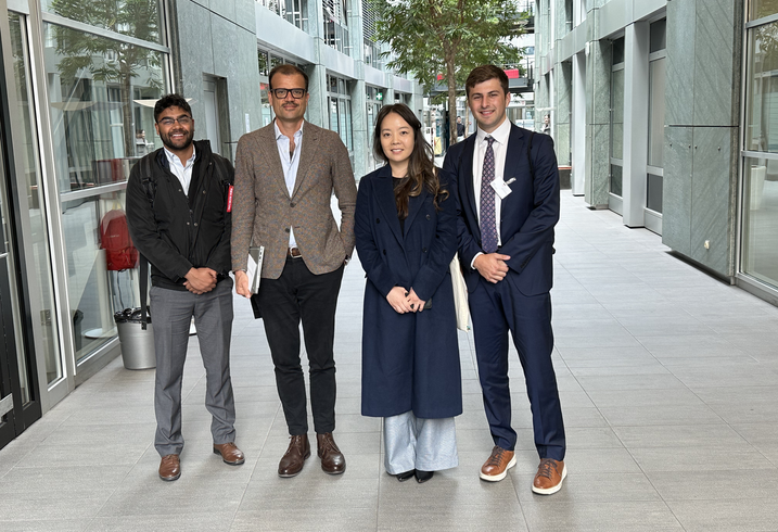 Suman Kumar, Dulguun Batmunkh, and Ben Zuercher with a local host in Switzerland.