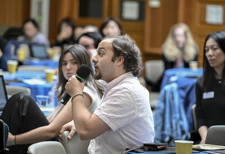 A student asks a question from the audience at the SCCEI China Conference.