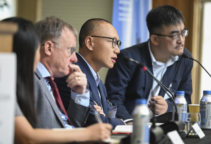 Dan Wang sits on a panel with Zhiguo He and Arthur Kroeber.