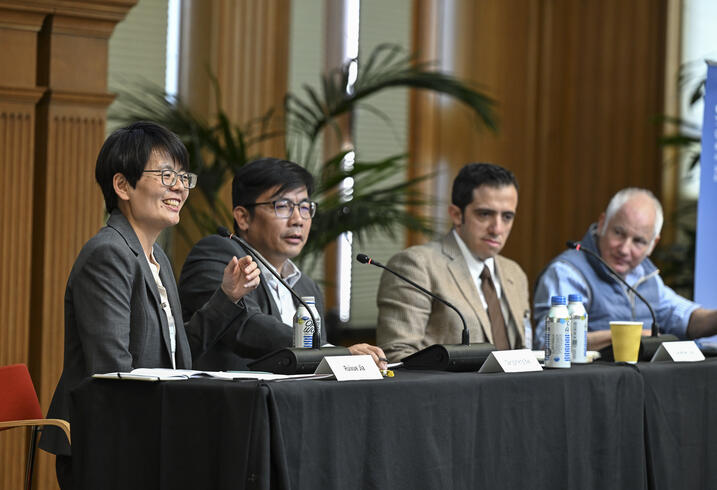 Ruixue Jia, Gaosheng Bao, Jonathan Czin, Arthur Kotkin sit on a panel at a conference.