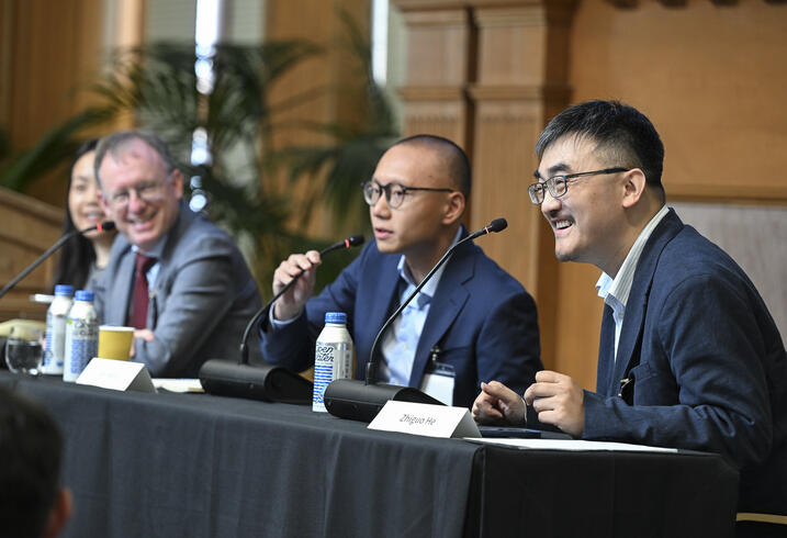 Panelists speak during a session at the 2025 SCCEI China Conference.