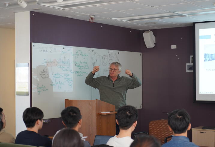 Scott Rozelle addresses a class of students.