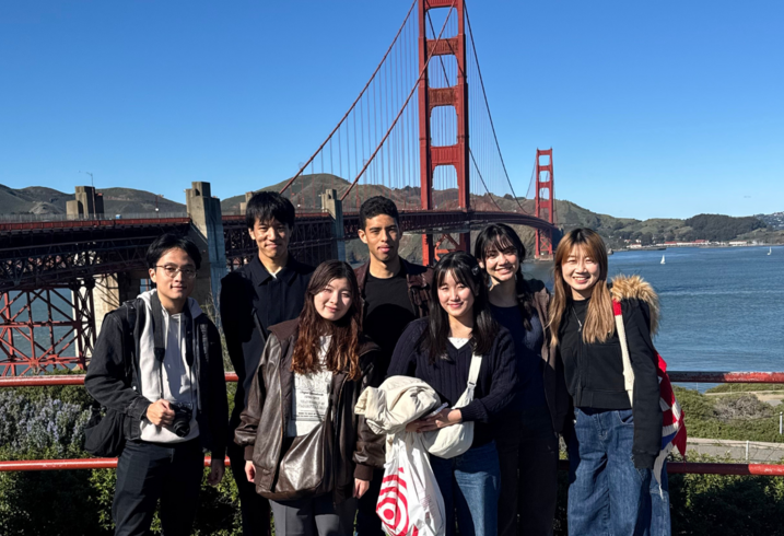 Students from the Stanford Japan Exchange Conference with the Golden Gate Bridge in the background.
