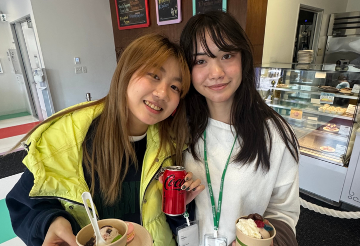Two students from the Stanford Japan Exchange Conference pose together with frozen desserts.
