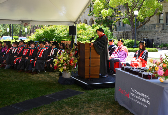 Francis Fukuyama leads the graduation ceremony of Ford Dorsey Master's in International Policy on the front lawn of Encina Hall at Stanford University.