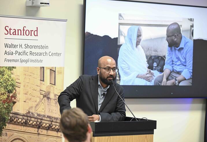 Tasneem Khalil delivers remarks at a lectern.
