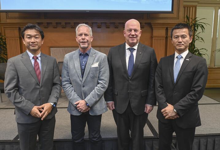 Naohiko Kohtake, Jeff Thornburg, Gen. John W. "Jay" Raymond, and Hide Kamiya pose for the camera.