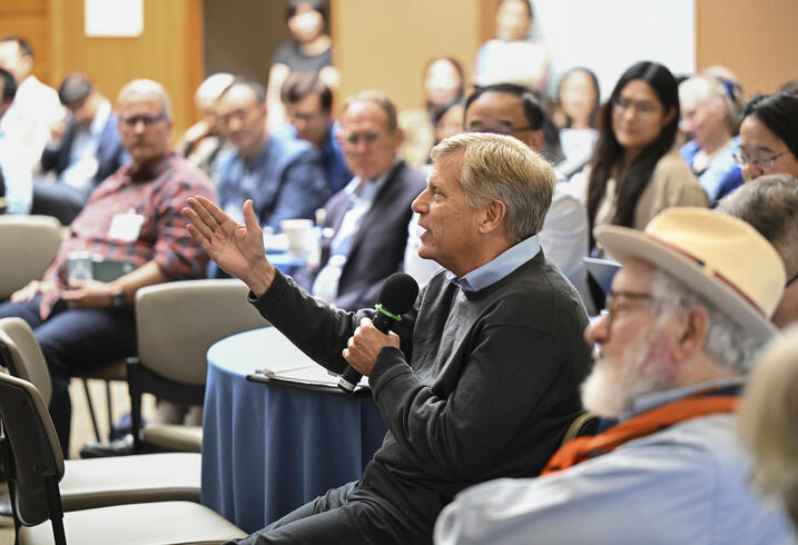 Michael McFaul asks a question for an event audience.