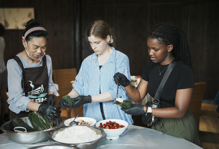 Students make Zongzi dumplings in China.