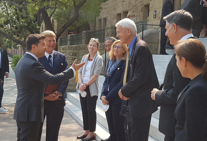 President Volodymyr Zelenskyy is greeted by Michael McFaul, Anna Grzymala-Busse, Francis Fukuyama, Kathryn Stoner, Steven Pifer, Markos Kounalakis and Lieutenant Governor Eleni Kounalakis.