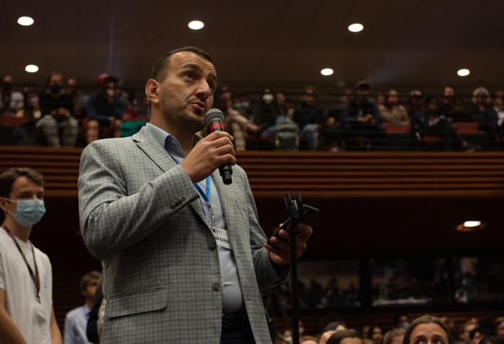 Nariman Ustaeiv, a visiting fellow with the Ukrainian Emerging Leaders Program at the Center on Democracy, Development and the Rule of Law, asks President Volodymyr a question during the Q&A portion of his special video address.