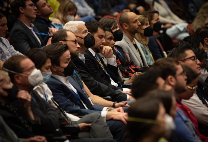 Audience members listen to President Zelenskyy of Ukraine speak via a live video address on May 27, 2022.