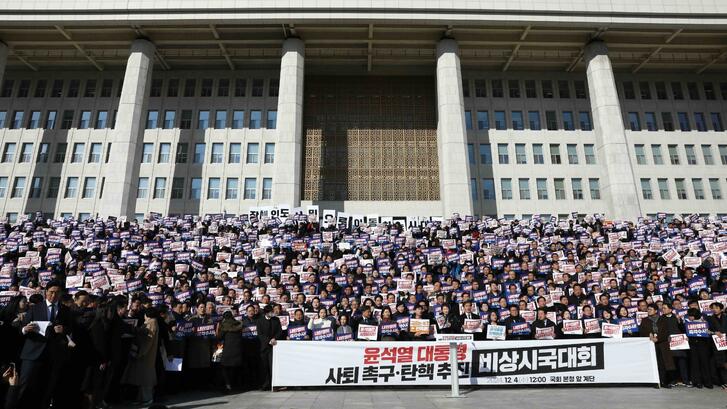 Lawmakers and members of the South Korea's main opposition Democratic Party (DP) demonstrate against the country's president at the National Assembly on December 04, 2024 in Seoul, South Korea. 