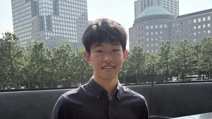 a person standing in front of buildings