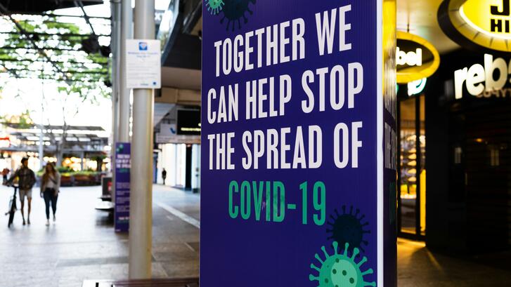 A sign that says "Together we can help stop the spread of COVID-19"