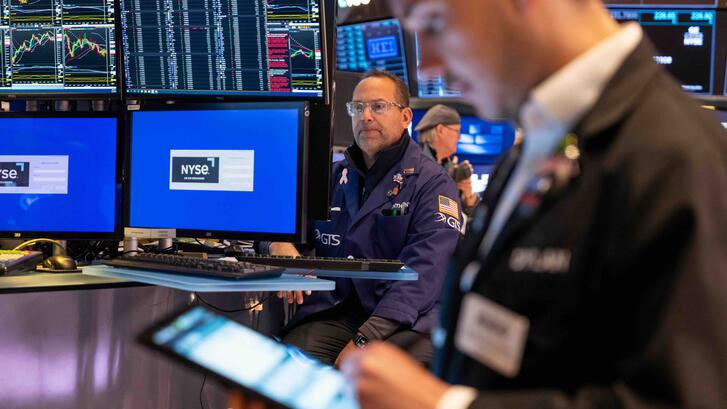 Traders work on the floor of the New York Stock Exchange (NYSE).