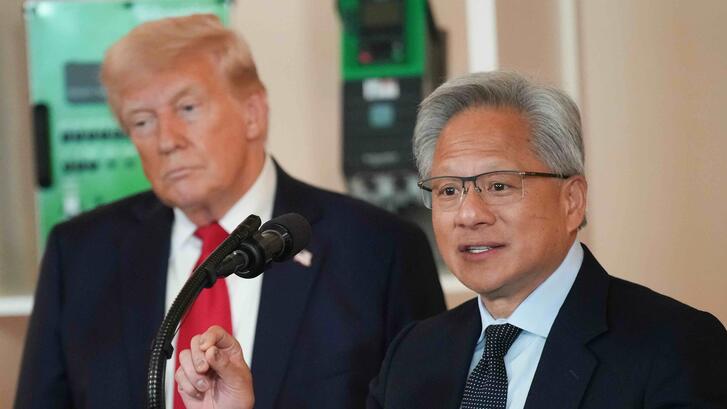 U.S. President Donald Trump (L) listens as Nvidia CEO Jensen Huang speaks in the Cross Hall of the White House during an event on "Investing in America" on April 30, 2025 in Washington, DC.