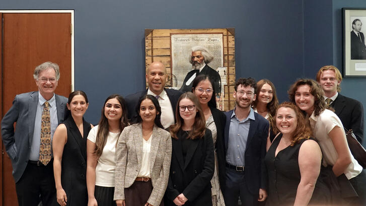 The Fisher Family Honors Program Class of 2026 and faculty pose with Senator Cory Booker.