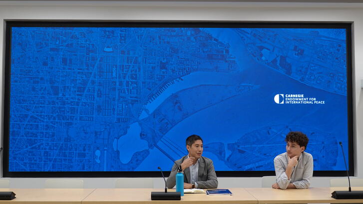 Steve Feldstein and Adrian Feinberg, '25, present to the group at the Carnegie Endowment for International Peace.