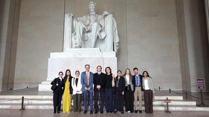 Students and faculty pose in front of the Lincoln Memorial during Honors College in Washington, D.C.
