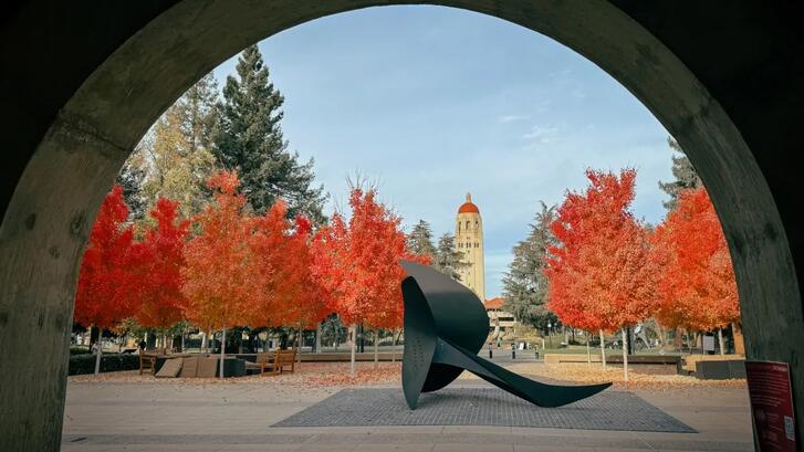 Campus sculpture with Hoover Tower in the bachground