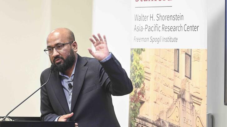 Tasneem Khalil delivers remarks at a lectern.