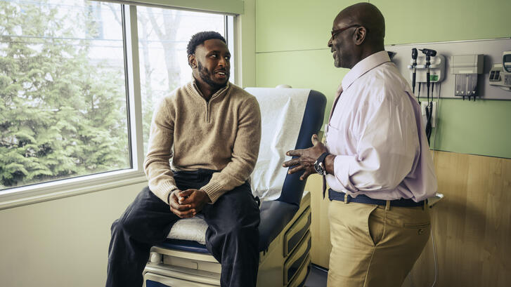 Older physician and young patient