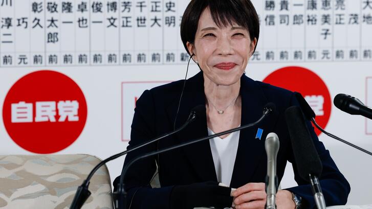 Japan's Prime Minister Sanae Takaichi speaks to the media in front of a board displaying the names of LDP candidates on general election day on February 8, 2026 in Tokyo, Japan.