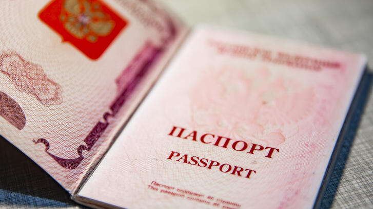 Russian passport on a gray stone background