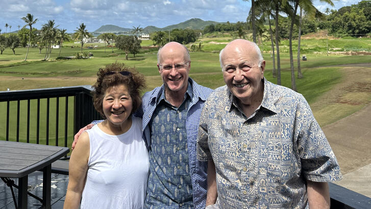 three people standing
