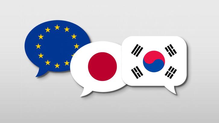 Illustration of three speech bubbles representing (from left to right) the flags of the EU, Japan, and South Korea.