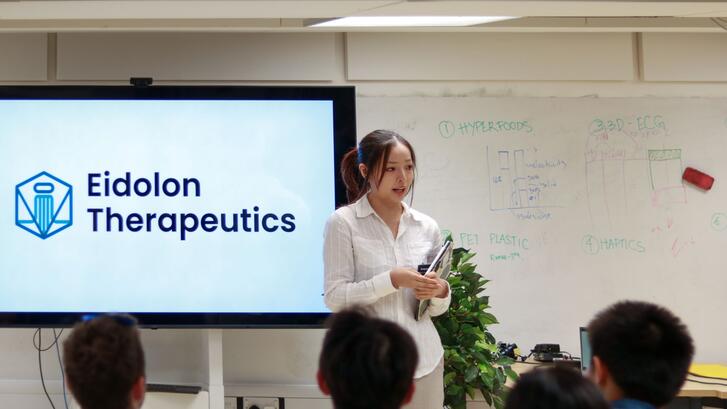 a person giving a presentation in a classroom