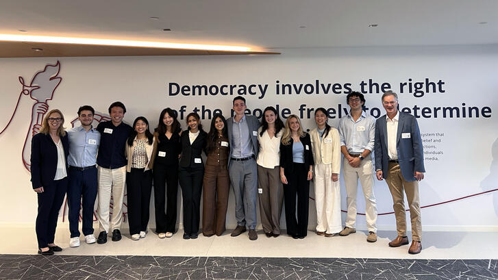Fisher Family Honors Class of 2027 poses in the lobby of the National Endowment for Democracy.